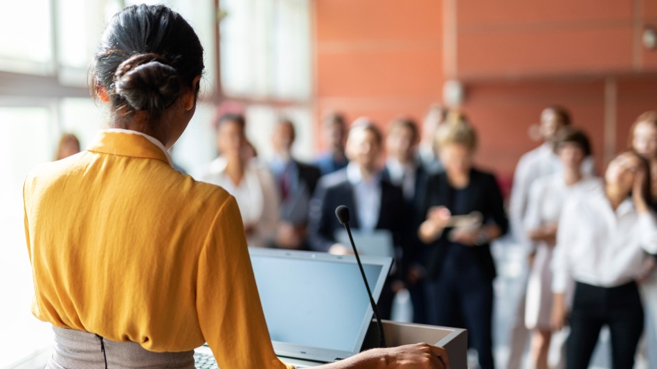 A lady in conference showcasing PR