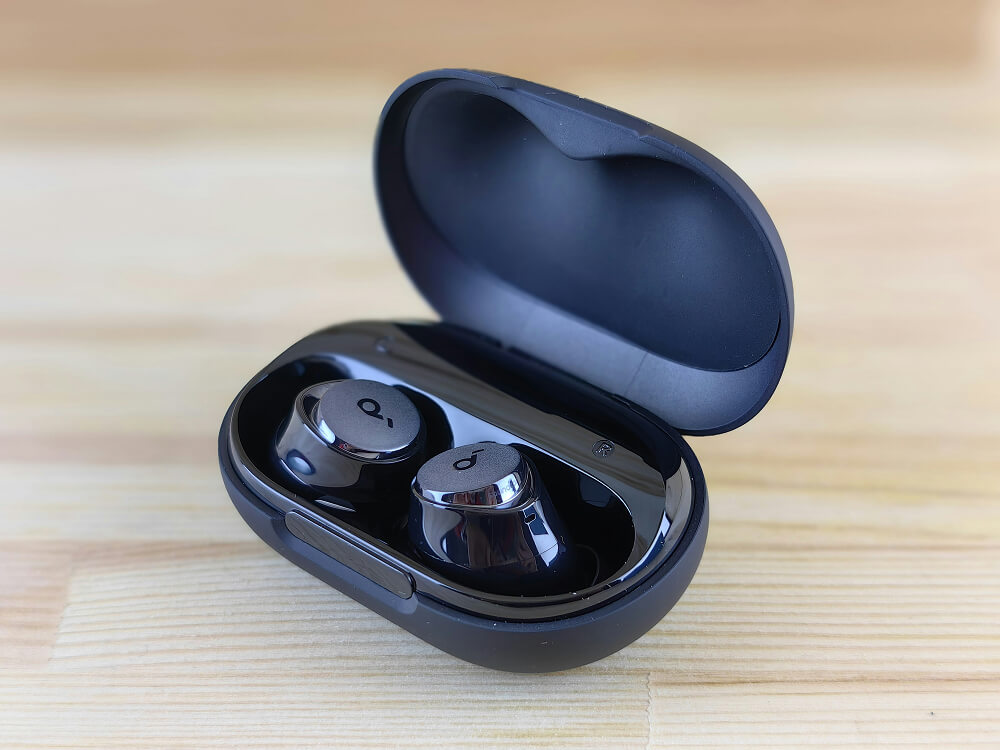 wireless earbuds black charging case product photography ai before